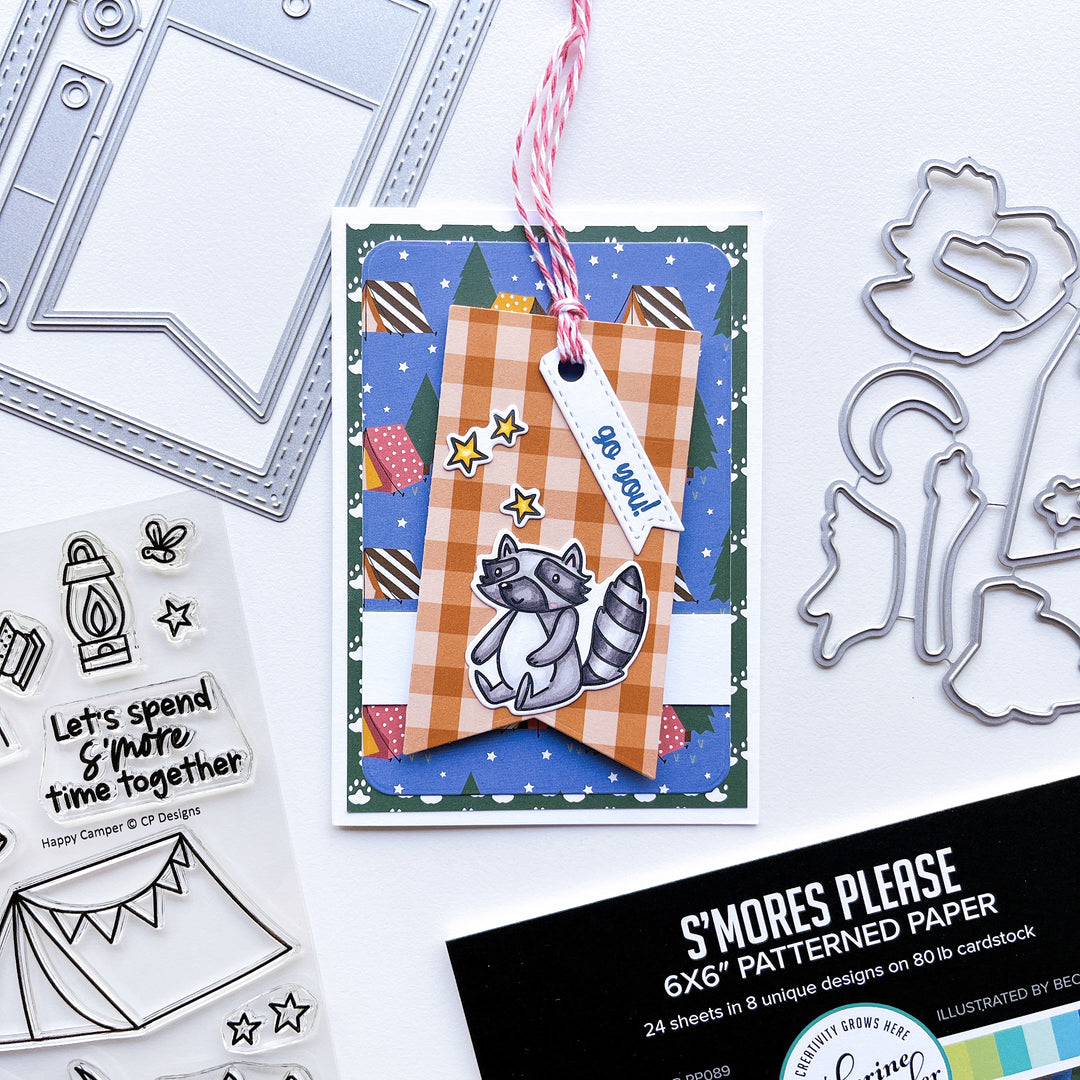 Go You card using S'mores Please patterned paper, Notecard Frame & Tag dies, Notecard Layers Dies, Happy Camper stamps and dies, Midnight and assorted ink pads and Party Twist twine.