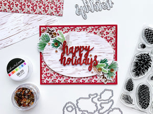 Pinecone Greetings around Happy Holidays diecut on patterned paper