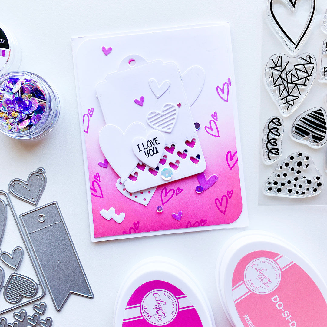 Pink blended ombre background with stamped hearts