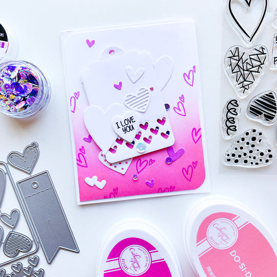 Pink blended ombre background with stamped hearts