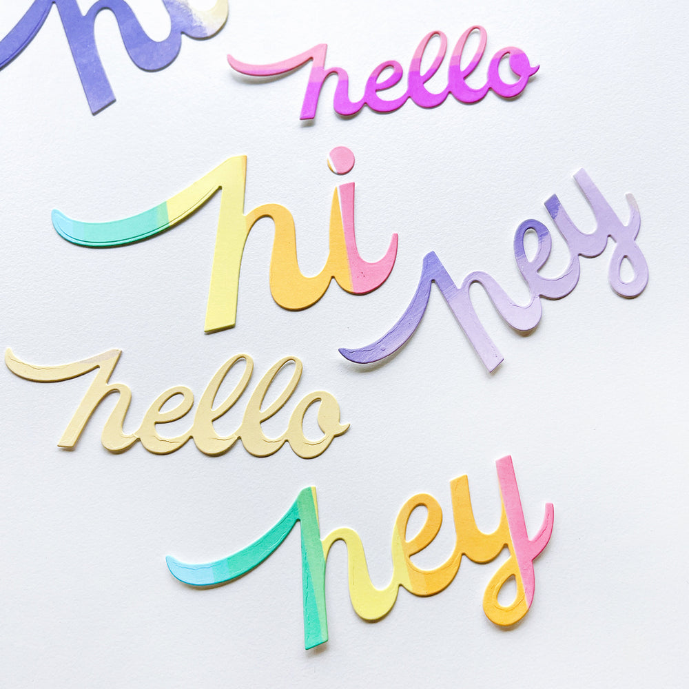 Die cut examples of the Hello Trio word dies.