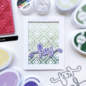 Hey card using Hey Word dies, Simply Diamonds background stamp, Crater Lake sequin mix, Crushed Violet, Lilac, Whipped Honey, Matcha, Sage and Spruce ink pads.