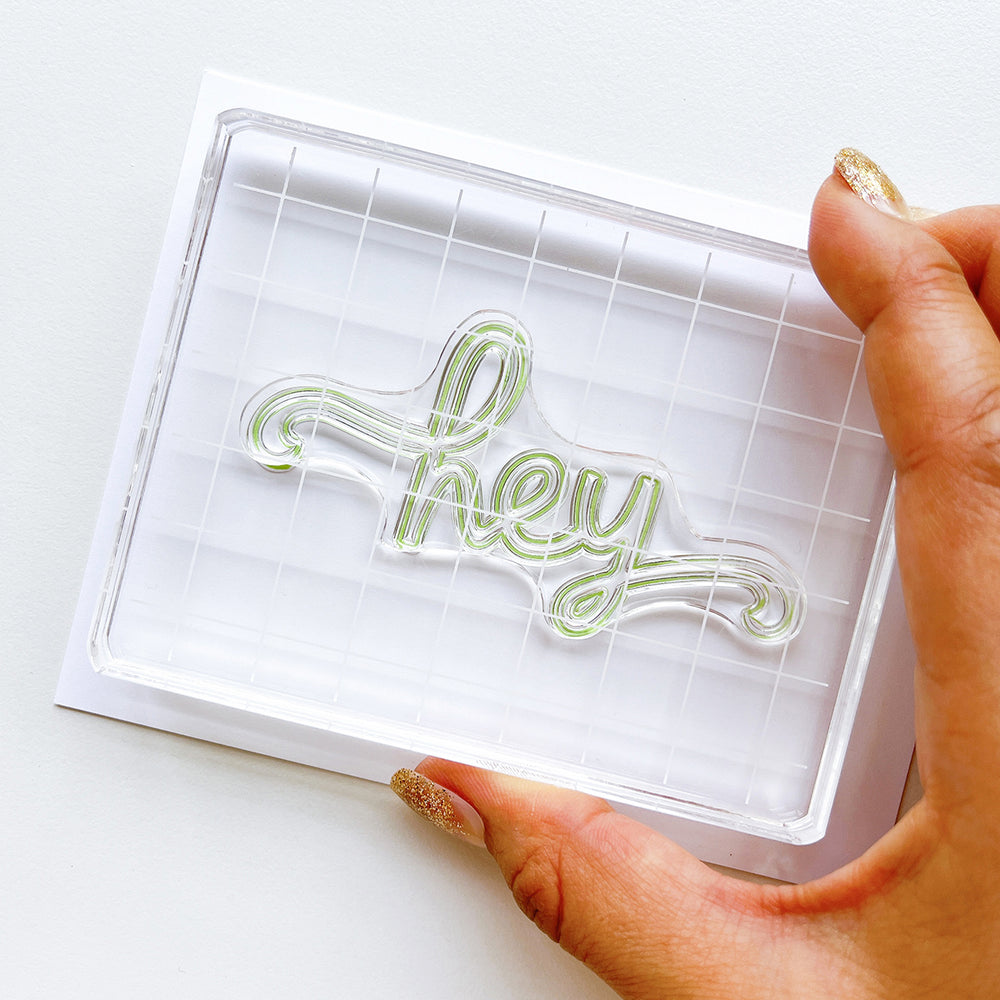 Stamping the Hey, Hey, Hey Sentiment stamp set.