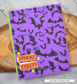 Purple card with black bats
