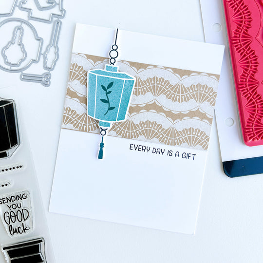 Blue lantern over white fan dance background stamped card