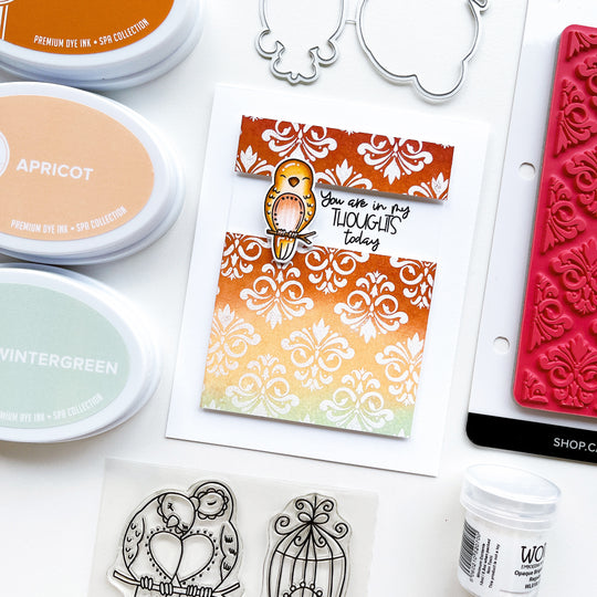 In my thoughts card using Lovebirds stamp set and dies, Filigree Background stamp, Wow Opaque White embossing powder, Midnight, Ginger, Apricot and Wintergreen ink pads. 