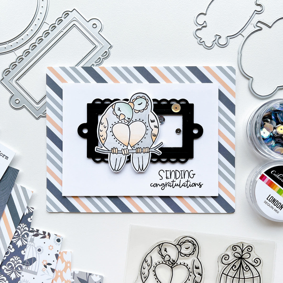Sending Congratulations card using Lovebirds stamp set and dies, Ex Libris dies, Twilight Reading patterned paper, Midnight ink pad and London sequin mix.