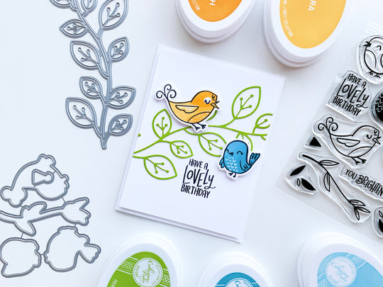 Blue and yellow birds on a branch birthday card