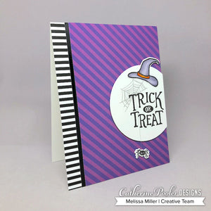 Purple striped background with spider web and witch hat