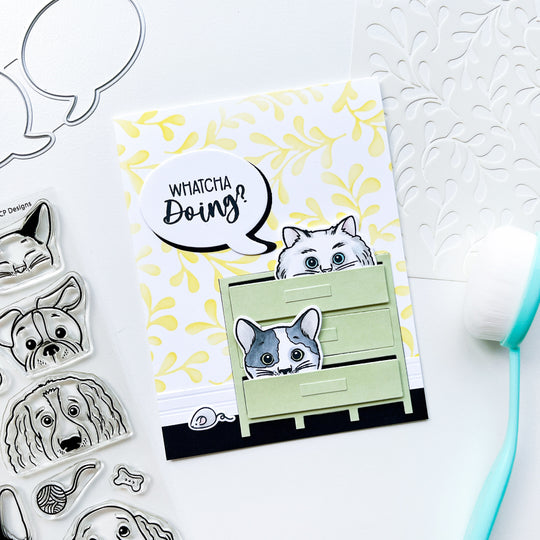 Whatcha Doing card using Look Who's Talking Sentiments stamps & dies, More Peeking Pets stamps & dies, Parqs & Rec cover plate, Flourish & Whimsy stencil, Midnight, Matcha, Whipped Honey and other ink pads. 