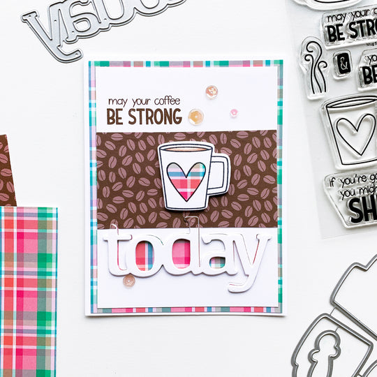 Plaid mug heart over bean patterned paper and  plaid background
