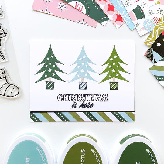 christmas is here card with trees