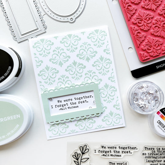 Whitman quote card using Filigree Background Stamp, Ex Libris dies, Wintergreen and Midnight ink pads, and Crater Lake sequins