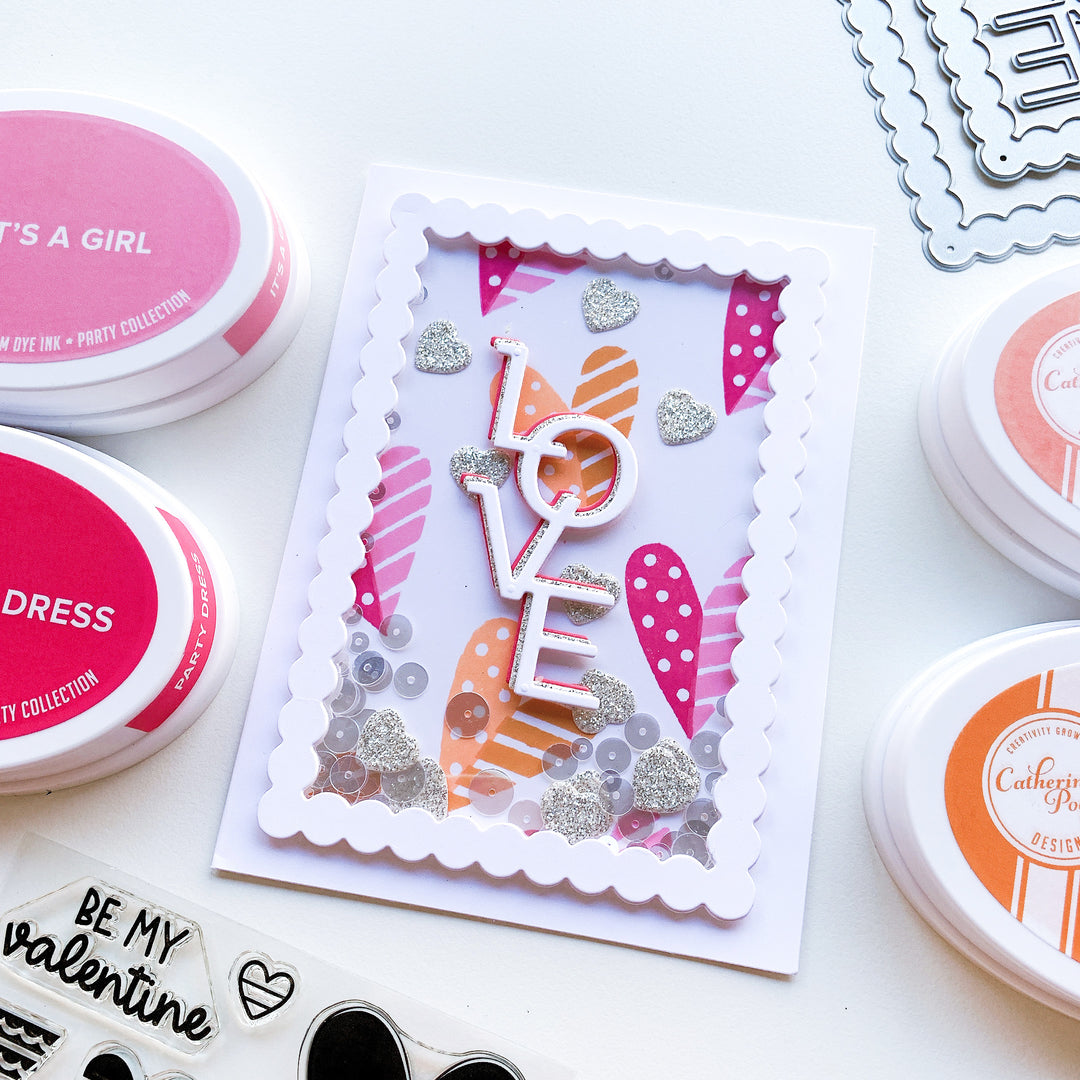 love shaker card next to ink pads
