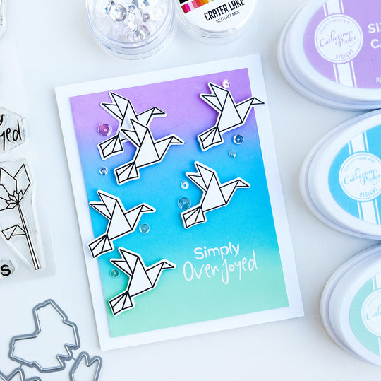 Flying origami birds over blended background card