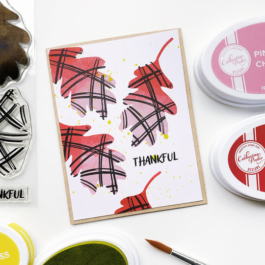 Thankful sentiment with orange and pink fall leaves and brown border