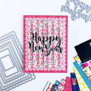 Happy New Year over floral patterned paper with layers of other patterned paper card