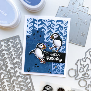 happy birthday card with puffins and among the seaweed background