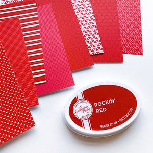 Rockin' Red Prints Patterned Paper spread out next to rockin red ink pad