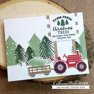 christmas tree farm with tractor and farm fresh christmas trees sign