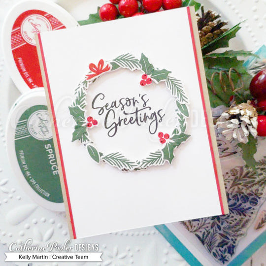 Season's greetings sentiment with holly wreath