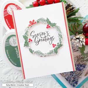 Season's greetings sentiment with holly wreath