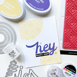 Hey card using Simply Diamonds background stamp, Double Duty Circle Dies, Hello Trio word dies, Crater Lake sequin mix, Wow! Opaque Bright White regular embossing powder, Crushed Violet and Whipped Honey ink pads.