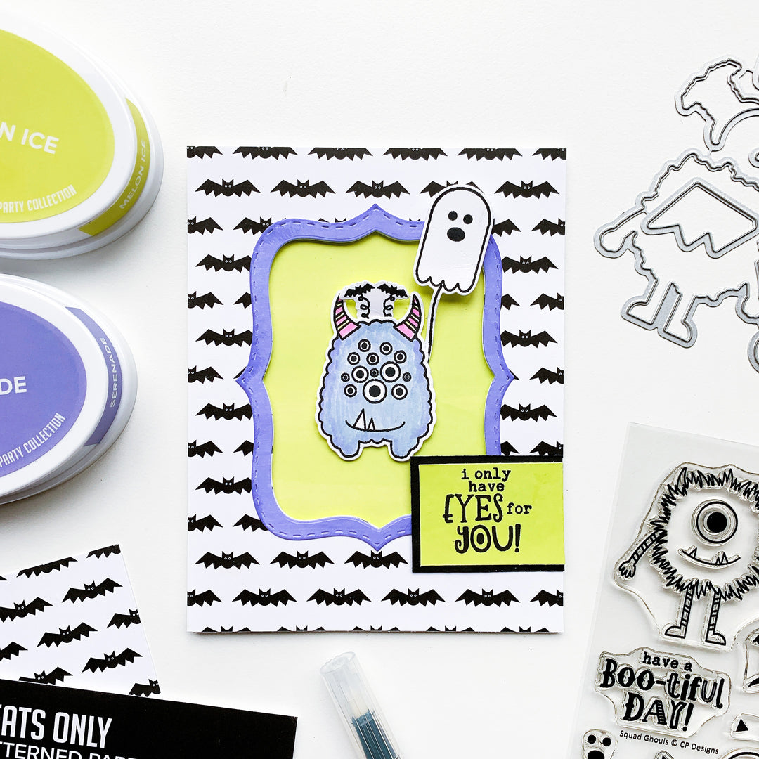 blue monster with bat patterned paper background
